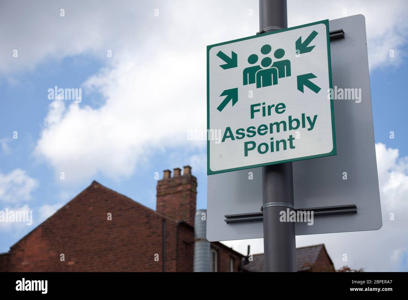 Information sign showing fire assembly point on the street. Stock Photo