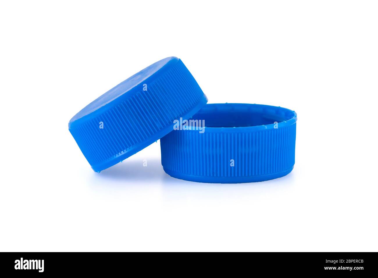 Two blue plastic bottle caps isolated on white Stock Photo