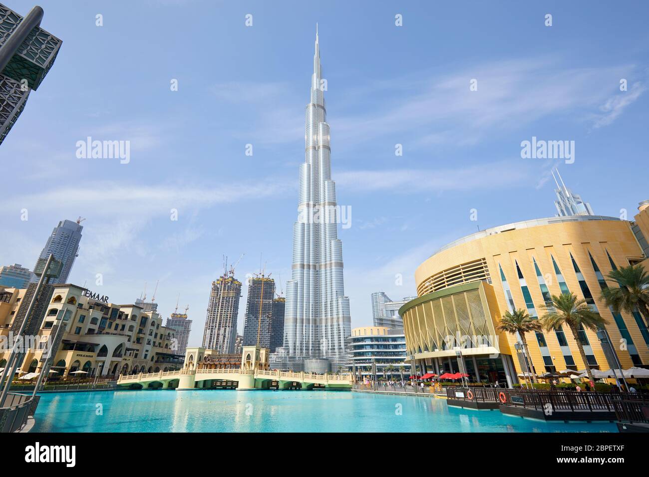 DUBAI, UNITED ARAB EMIRATES - NOVEMBER 19, 2019: Burj Khalifa skyscraper Dubai Mall and artificial lake in a sunny morning Stock Photo