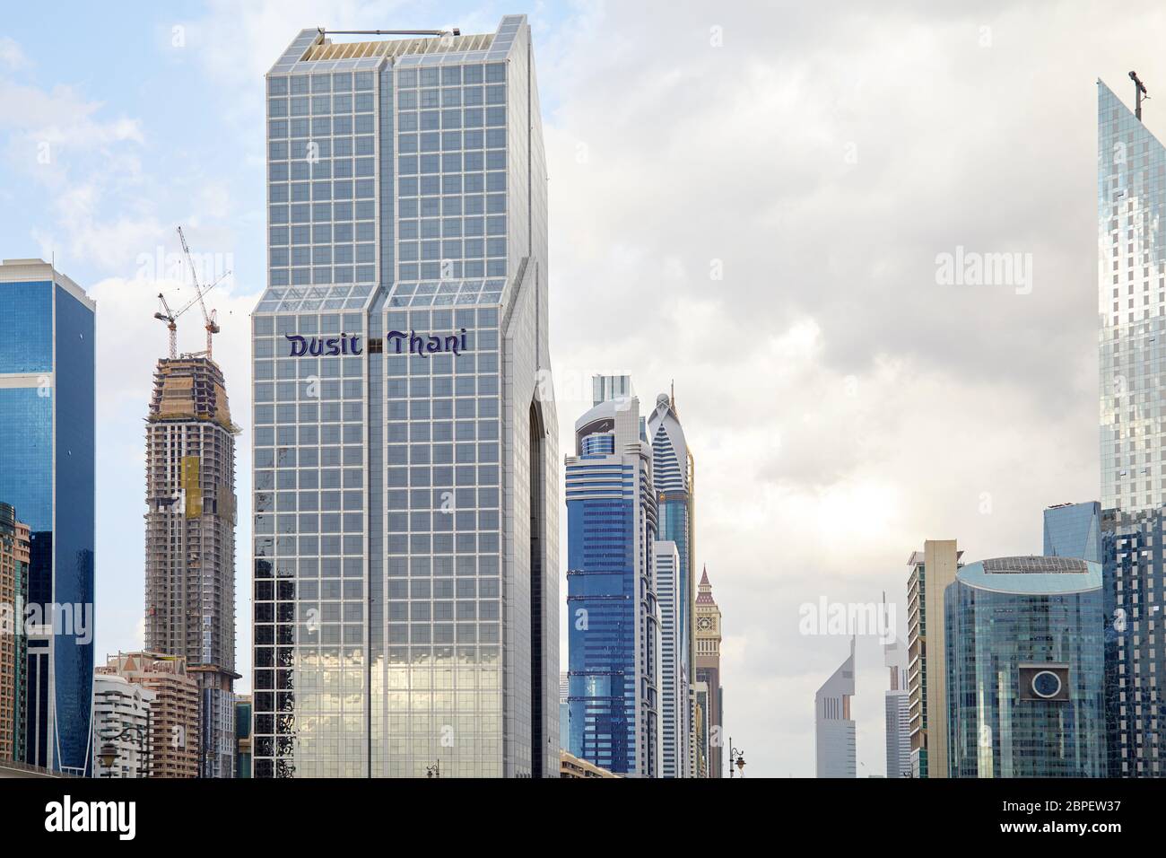 DUBAI, UNITED ARAB EMIRATES - NOVEMBER 21, 2019: Dusit Thani hotel and Sheikh Zayed Road view with modern skyscrapers in a cloudy day Stock Photo