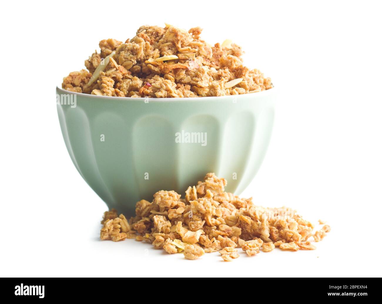 The granola breakfast cereals in bowl isolated on white background