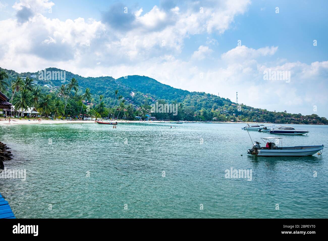 Koh Phangan, Thailand, February 2020: People swim and sunbathe on Haad yao beach, Koh Phangan. Stock Photo