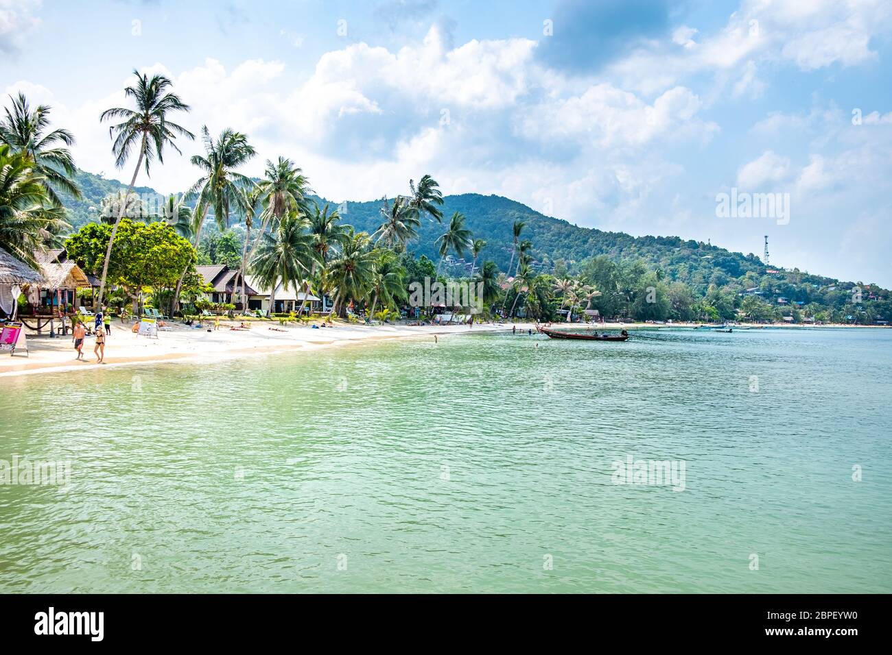 Koh Phangan, Thailand, February 2020: People swim and sunbathe on Haad yao beach, Koh Phangan. Stock Photo
