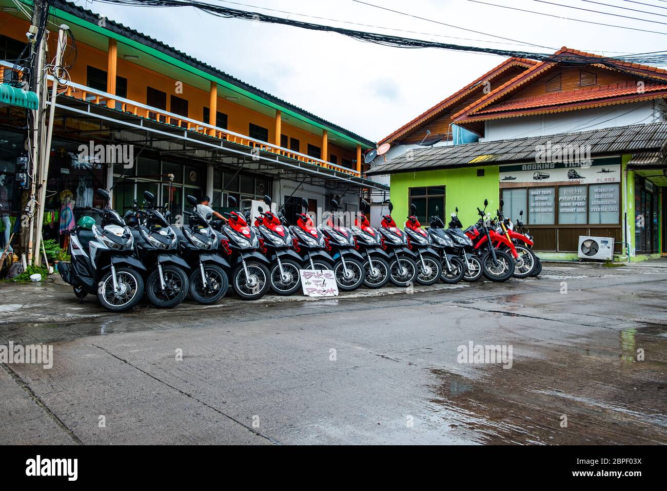Ko Pha Ngan, THAILAND - FEBRUARY 2020: Motorbikes for rent in Ko Pha Ngan, view of the street, road. Stock Photo
