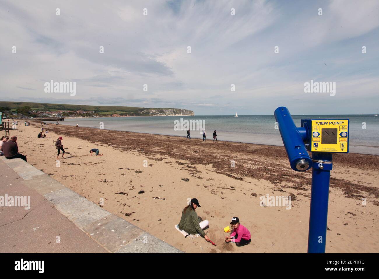 Swanage Bay during Coronavirus lockdown, Dorset UK May 2020.  As restrictions are eased people are now allowed on the beaches - and to sunbathe Stock Photo