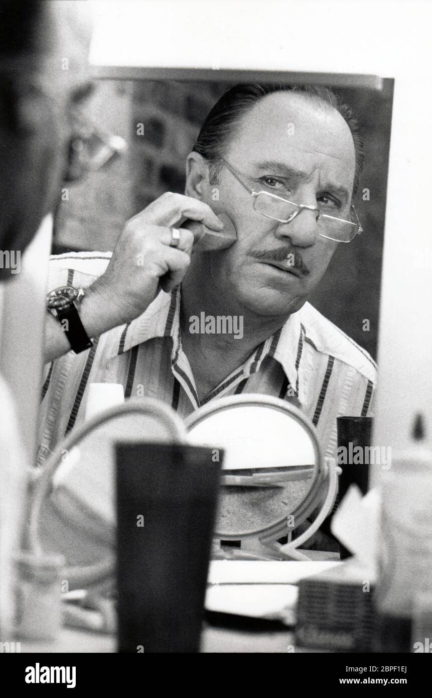 Character actor Dick Wilson, known for playing Mr. Whipple, applies makeup prior to a summer theater performance in Salt Lake City, Utah circa 1978. Stock Photo