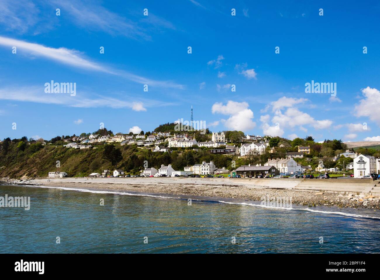 View across the sea to the seafront and beach. Laxey, Isle of Man, British Isles Stock Photo
