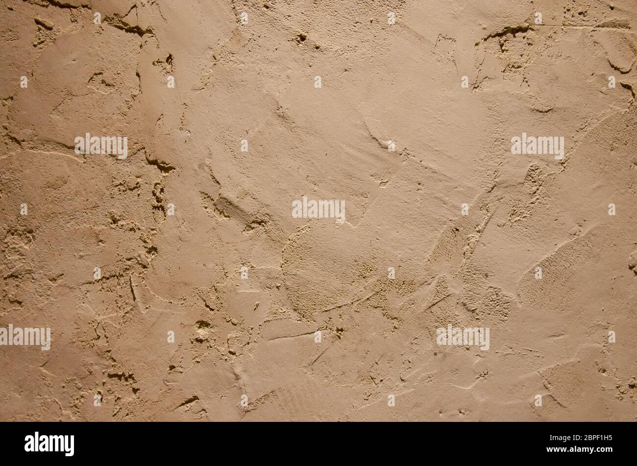 Cement wall cream color background Stock Photo - Alamy