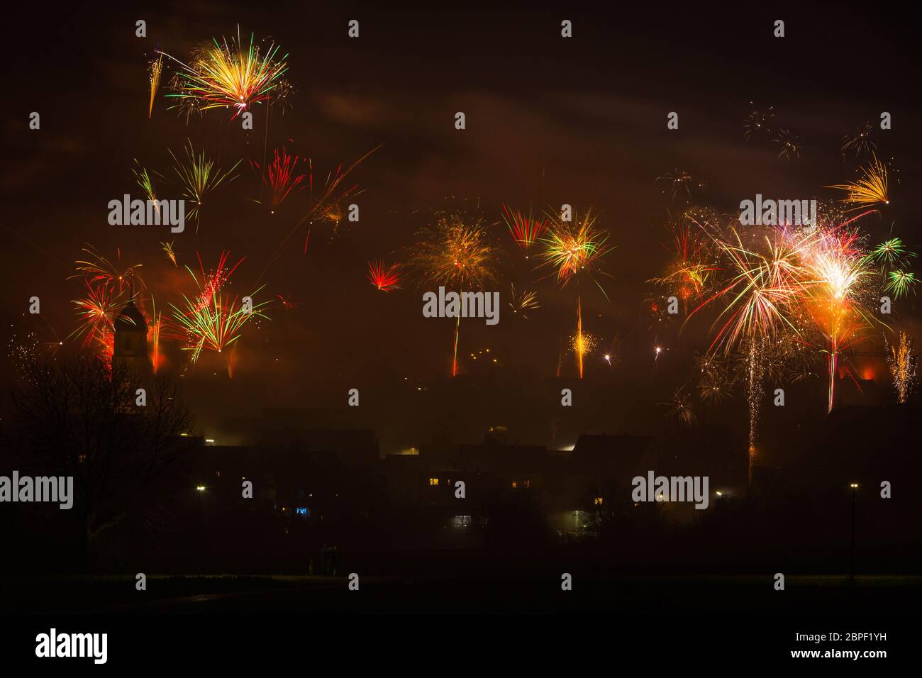 fireworks on new years eve with colorful rockets Stock Photo