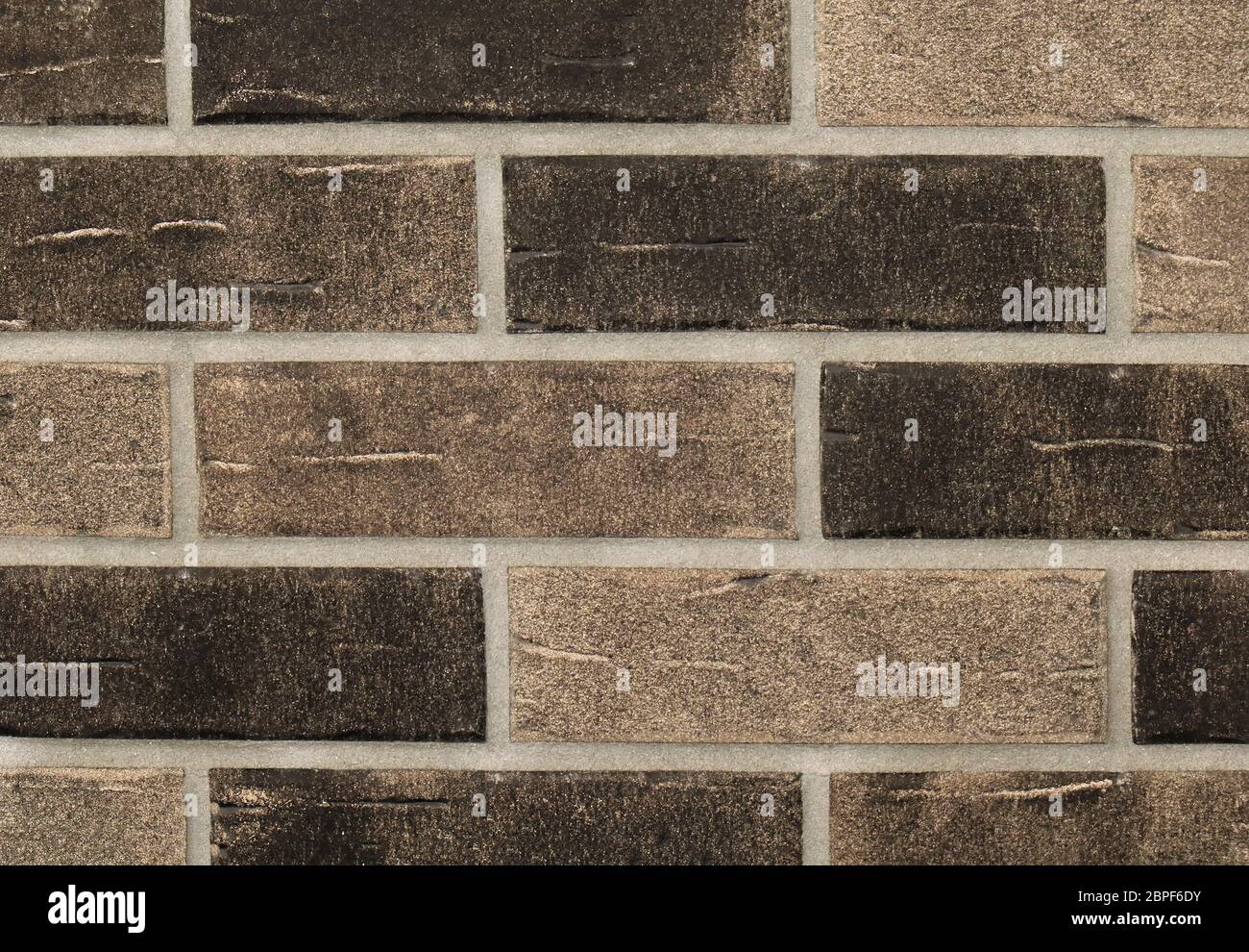 Grainy texture brown bricks wall pattern background Stock Photo