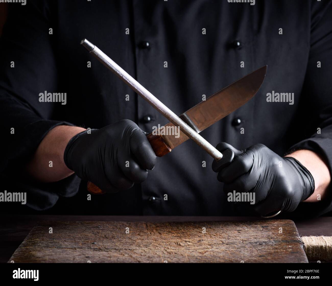 Hand man sharpens blade knife hi-res stock photography and images - Alamy