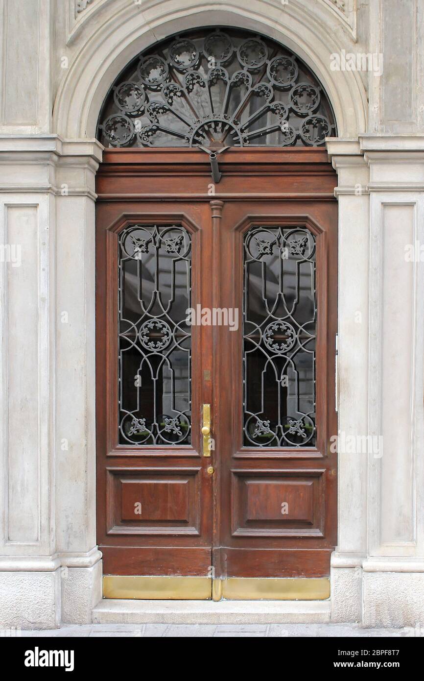 Old vintage closed door exterior with wooden and glass design Stock