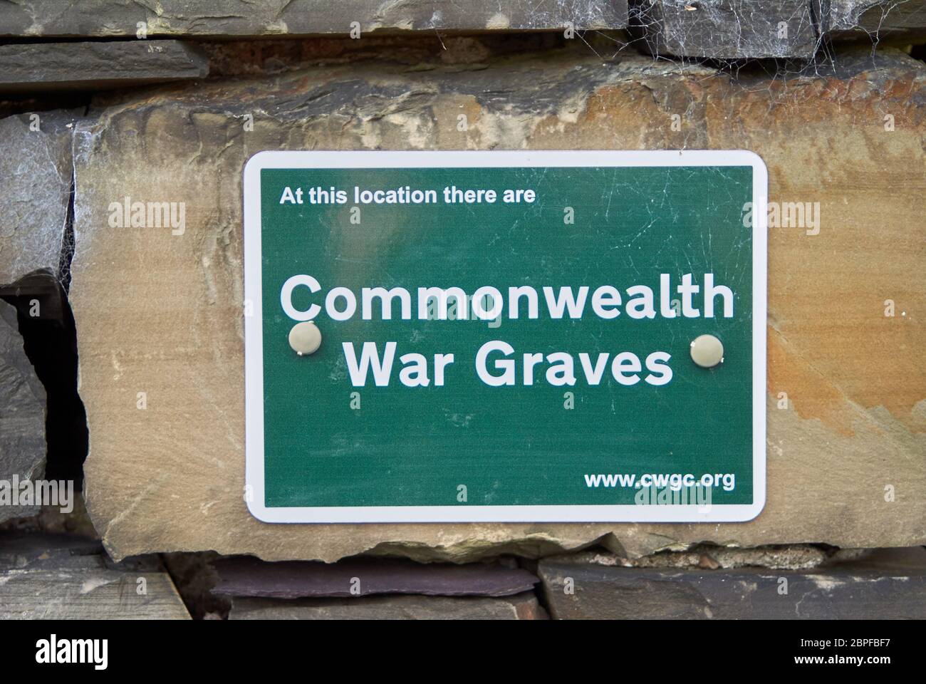 Commonwealth War Graves signage outside a church denoting burial of combatants in the church yard Stock Photo