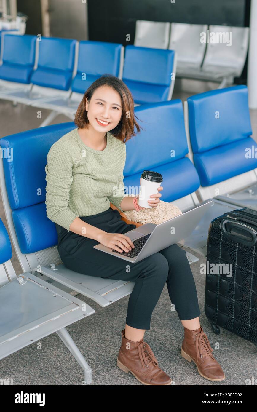 Airport woman laptop hi-res stock photography and images - Alamy