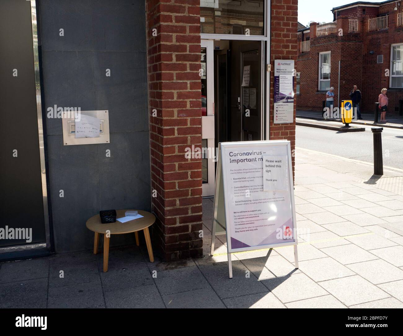 Notice outside a NatWest Bank asking customers to socially distance when in the bank. Stock Photo
