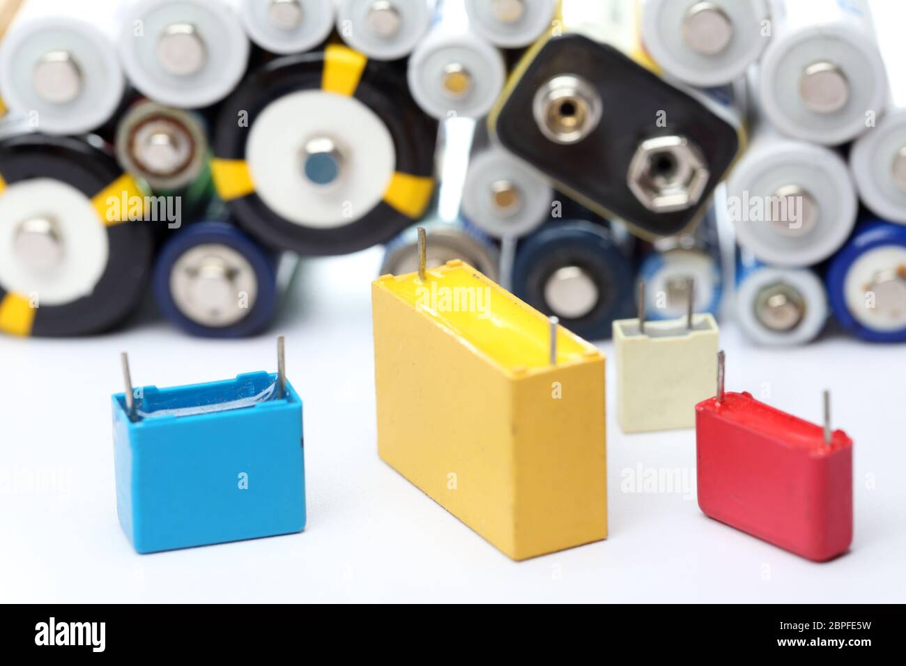 some electronic scrap with capacitors and batteries Stock Photo Alamy