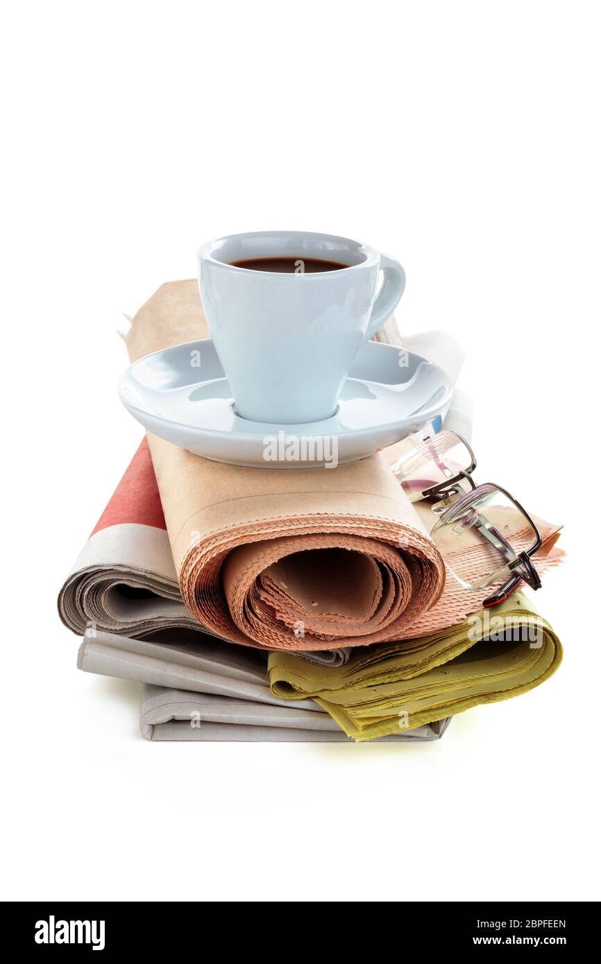 Coffee and newspapers isolated on white background. Stock Photo