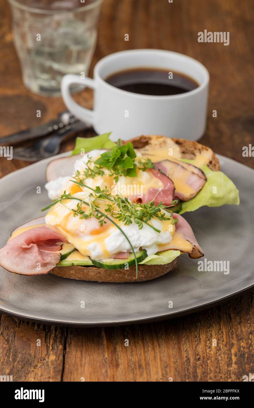 closeup of a eggs benedict with coffee Stock Photo