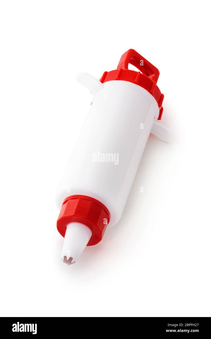 Closeup shot of culinary syringe isolated on white background Stock