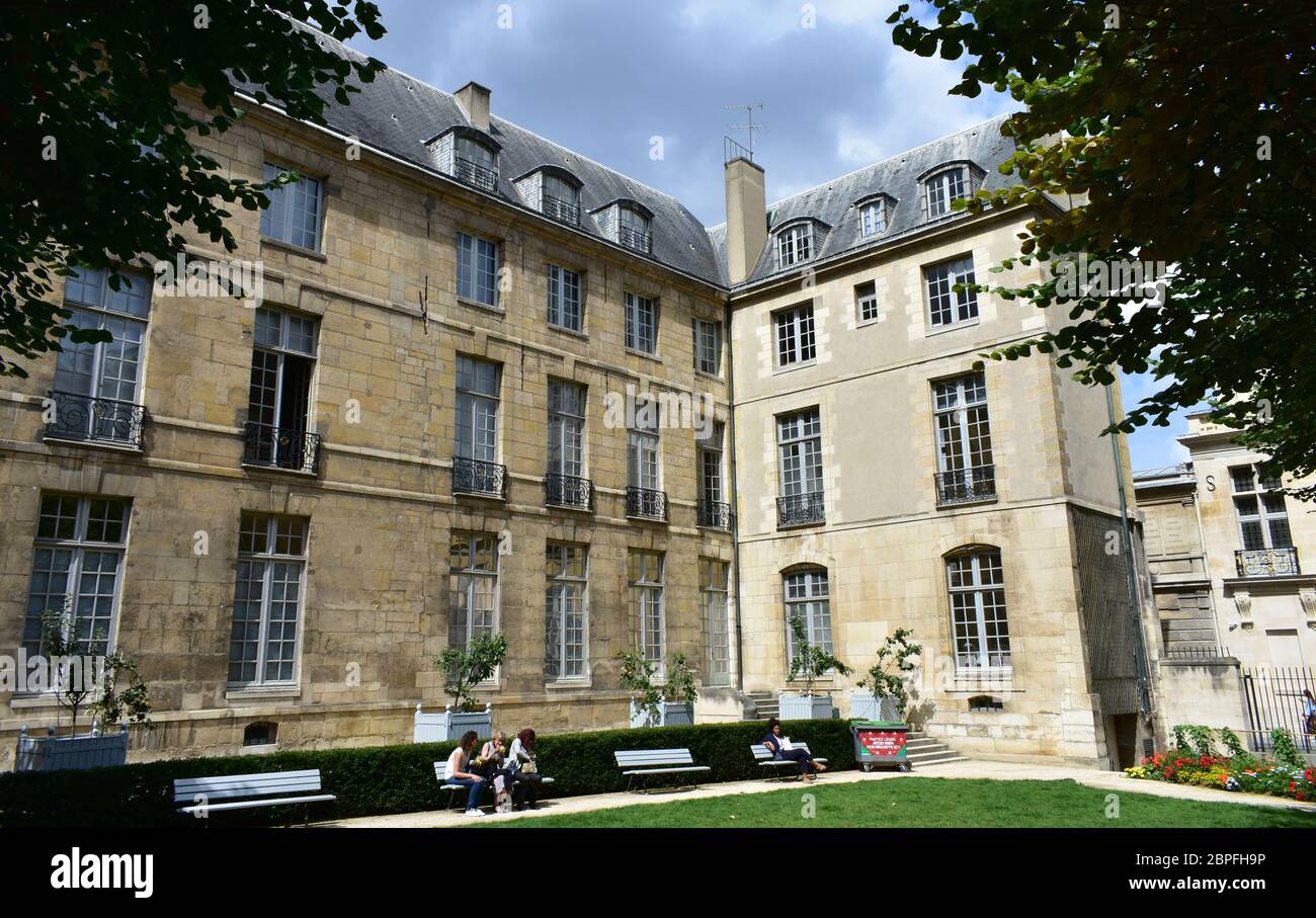 Garden in parisian style mansion known as hotel particulier. Hotel de Lamoignon townhouse. Paris, France. August 14, 2019. Stock Photo