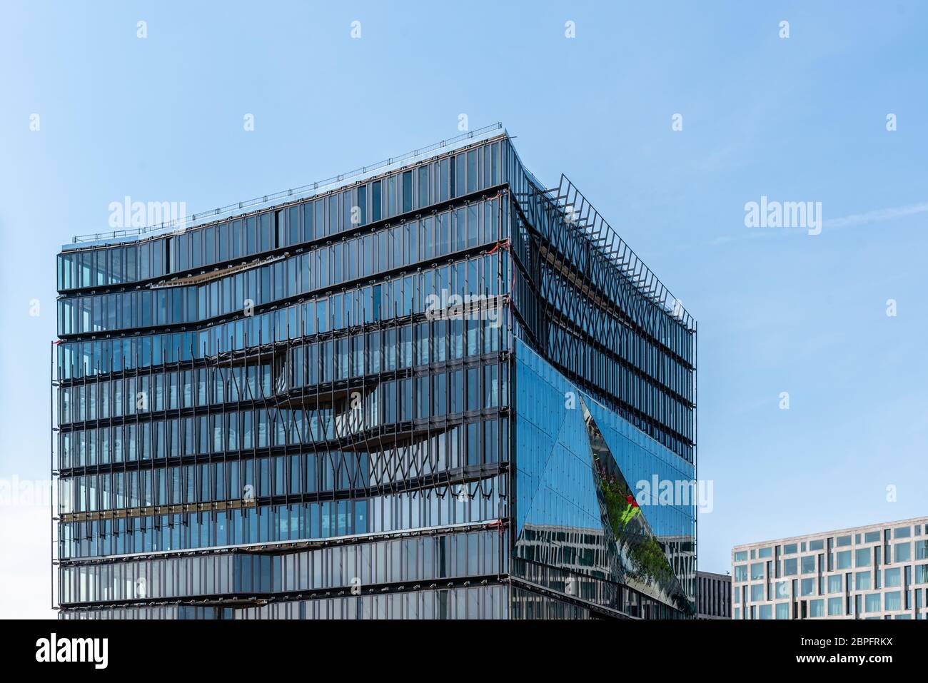 Berlin, Germany - July 28, 2019: Cube Berlin, a modern glass office building located on Washingtonplatz, besides central station and Spreebogen Stock Photo