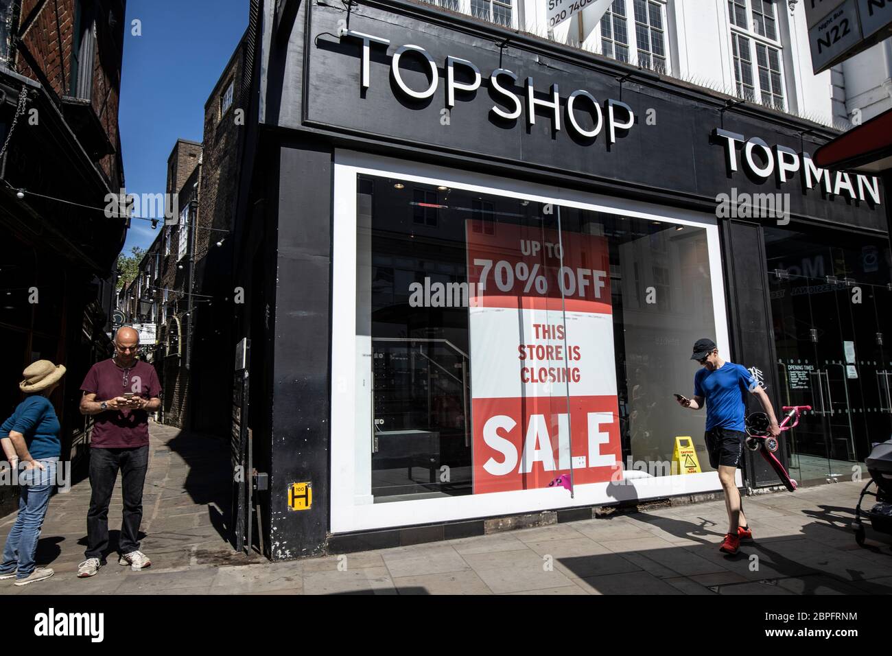 Topshop 70% closing down sale, high street clothing retail shop closing due to the effects of coronavirus COVID-19 pandemic across the UK Stock Photo