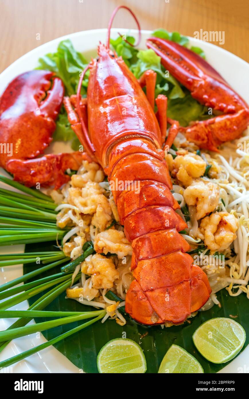 Lobster Pad thai, stir fried Thai rice noodle pasta with whole lobster