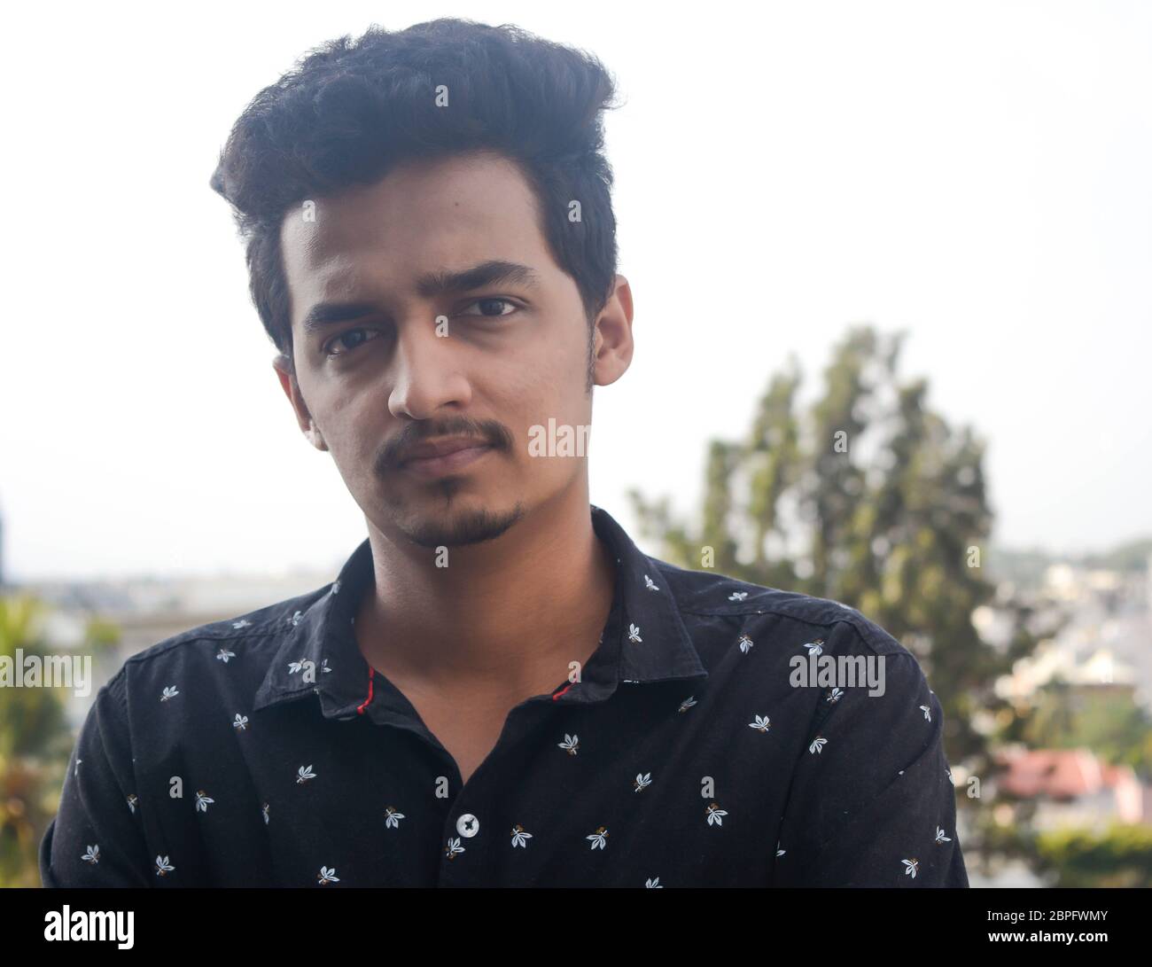 Simple portrait of stylish man , looking straight at the camera Stock
