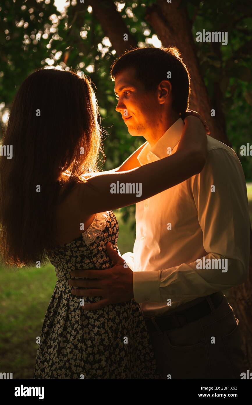 Beautiful young couple in the park Stock Photo - Alamy