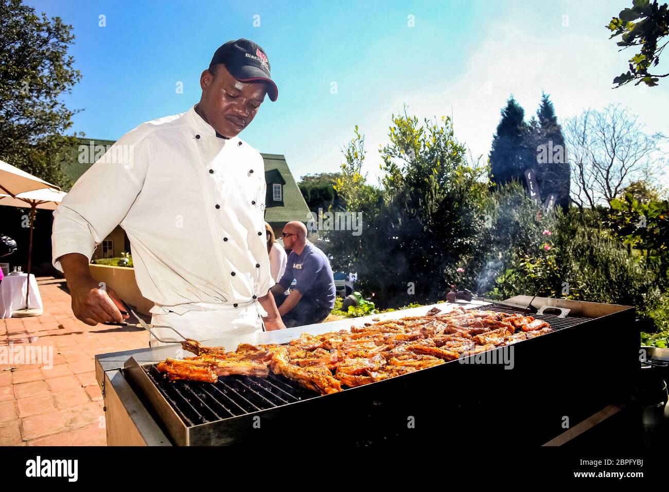 Johannesburg, South Africa May 21, 2011 African man working a BBQ