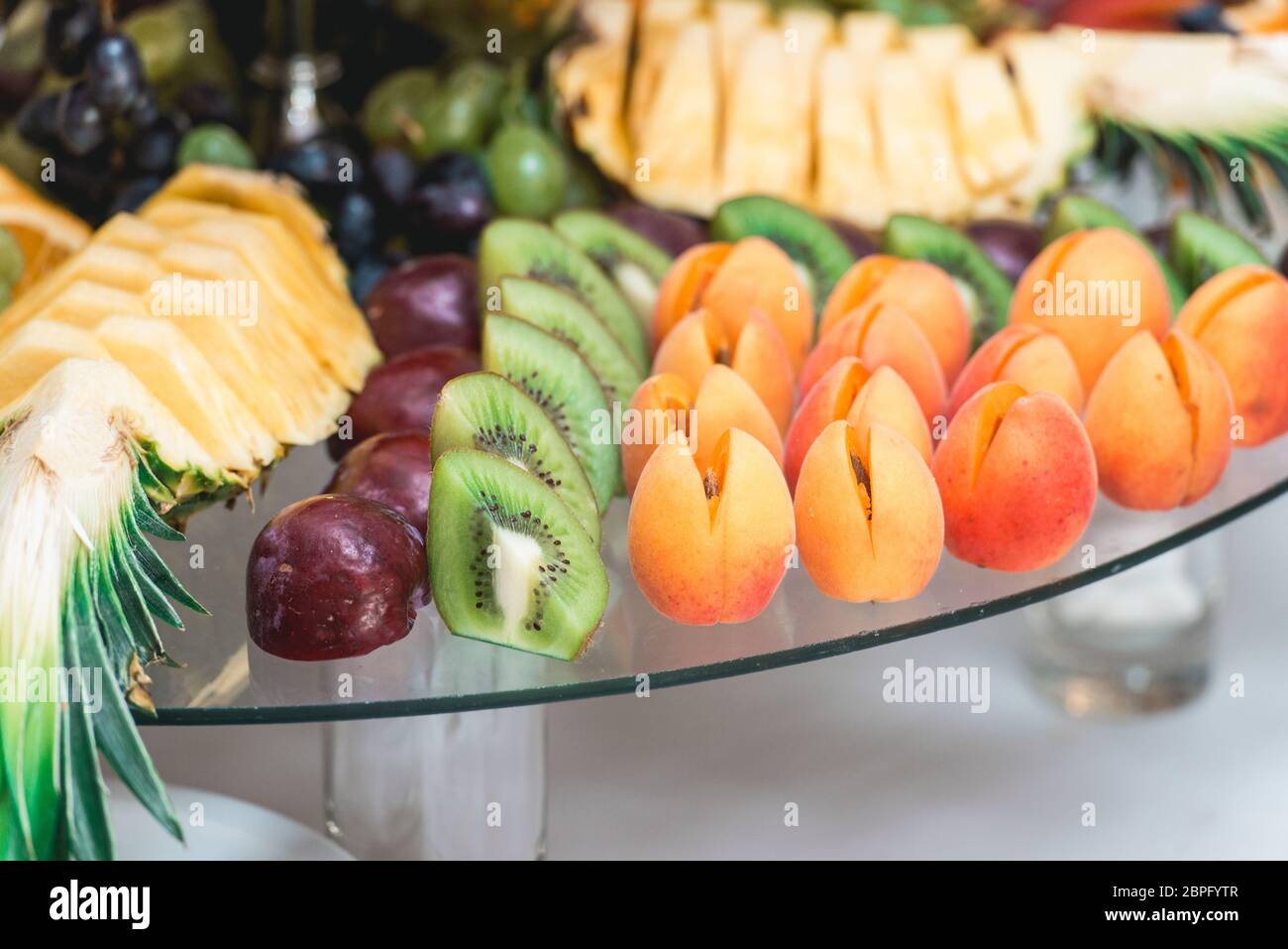apricots plums pineapple and kiwi Stock Photo