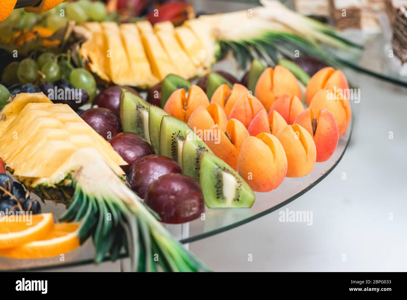 apricots plums pineapple and kiwi Stock Photo