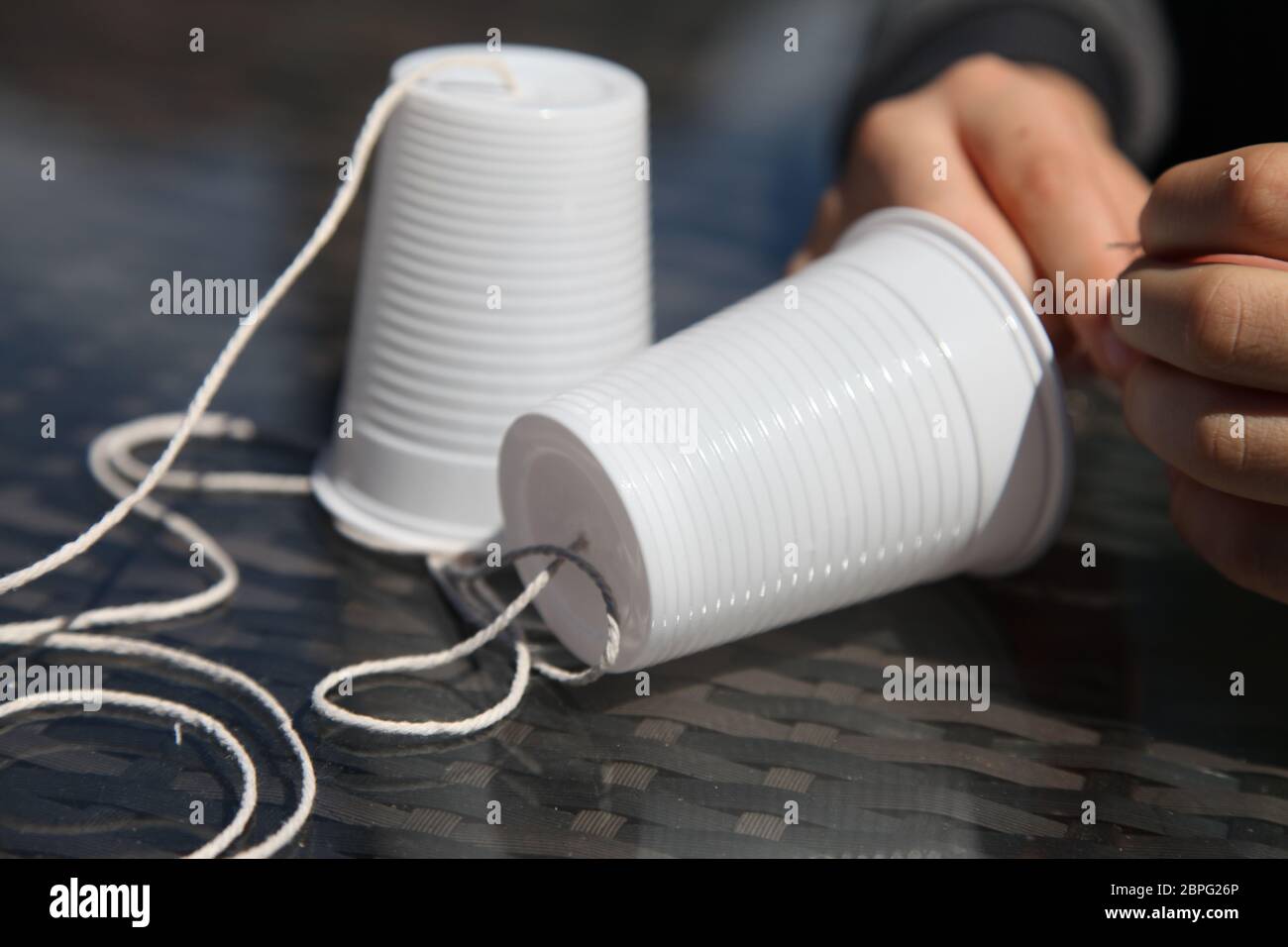 Making a telephone from plastic cups and string, School Science