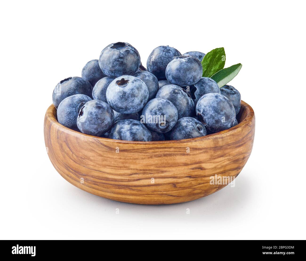 Beautiful blueberries with blueberry leaves in wooden bowl isolated on white background Stock