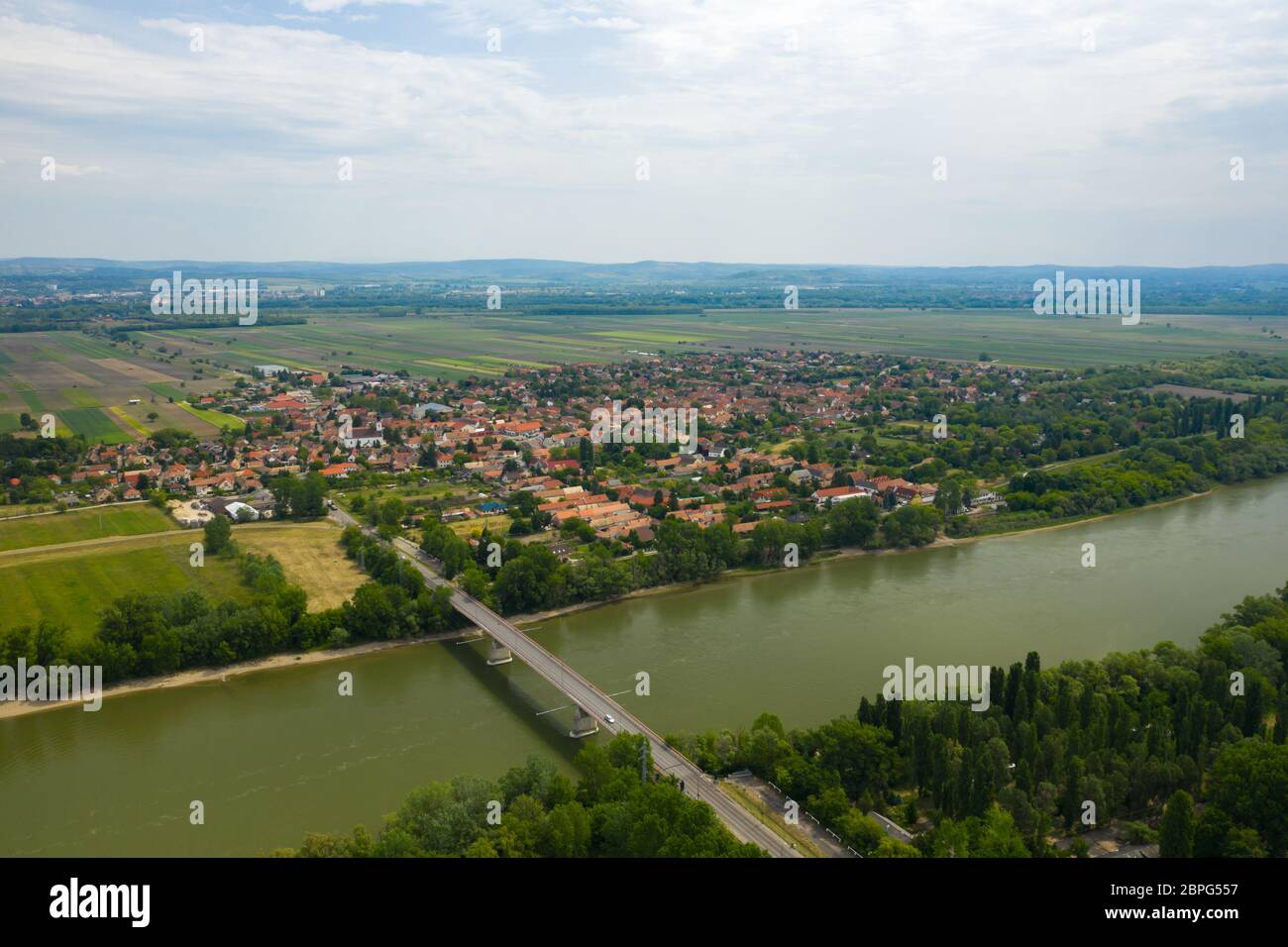 Zoltan Tildy Bridge over Danube river. Tahitotfalu in the background. Stock photo made on sunny summer day. Stock Photo