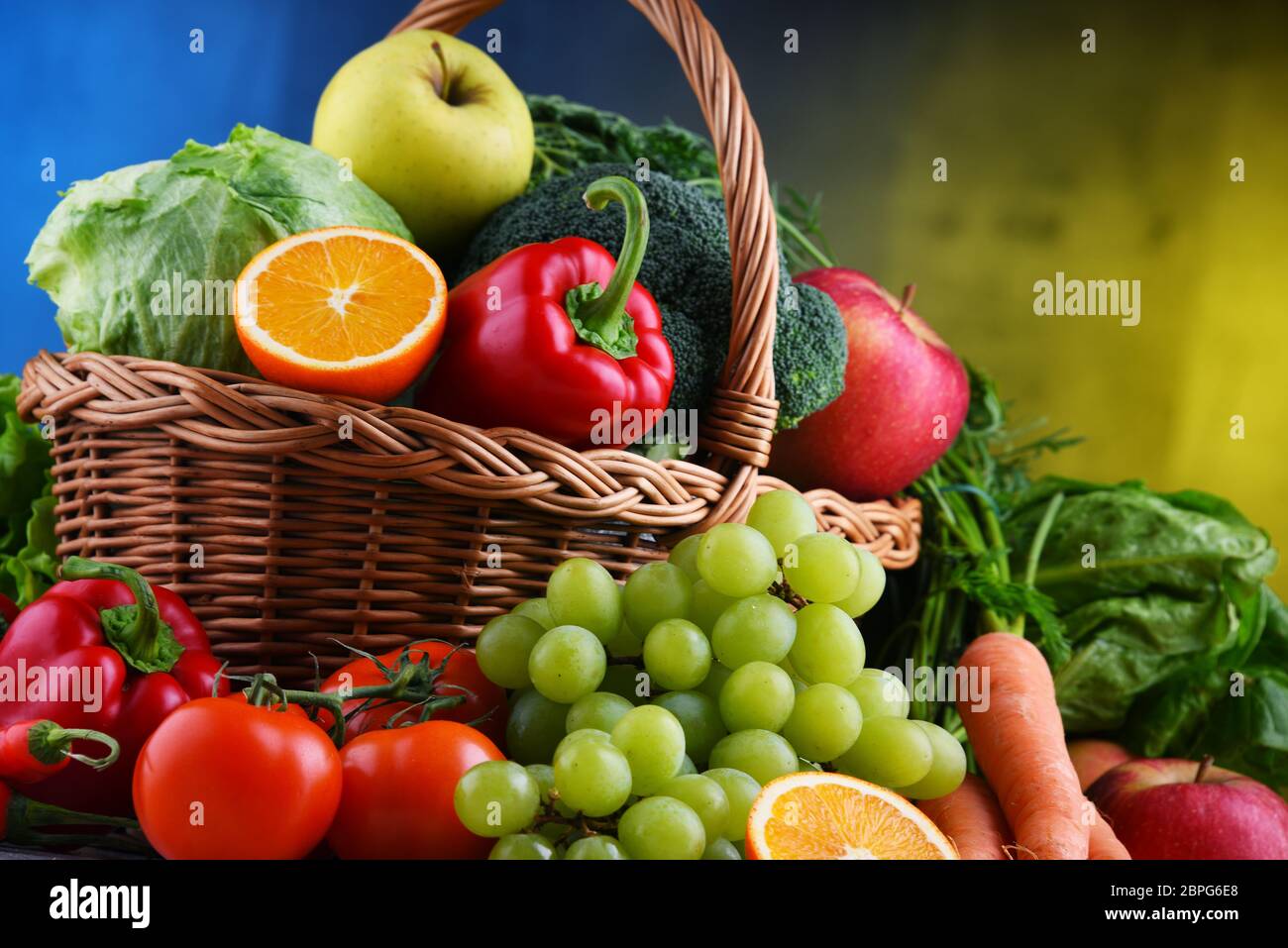 Fresh organic fruits and vegetables in wicker basket Stock Photo - Alamy