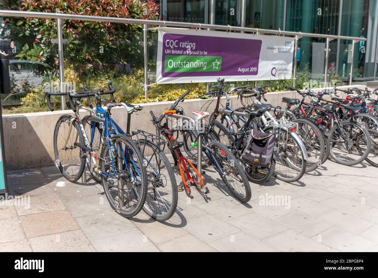 Bristol-May-2020-England-a close up view of bycles lined up outside the Bristol university all locked up to the bike rackes Stock Photo