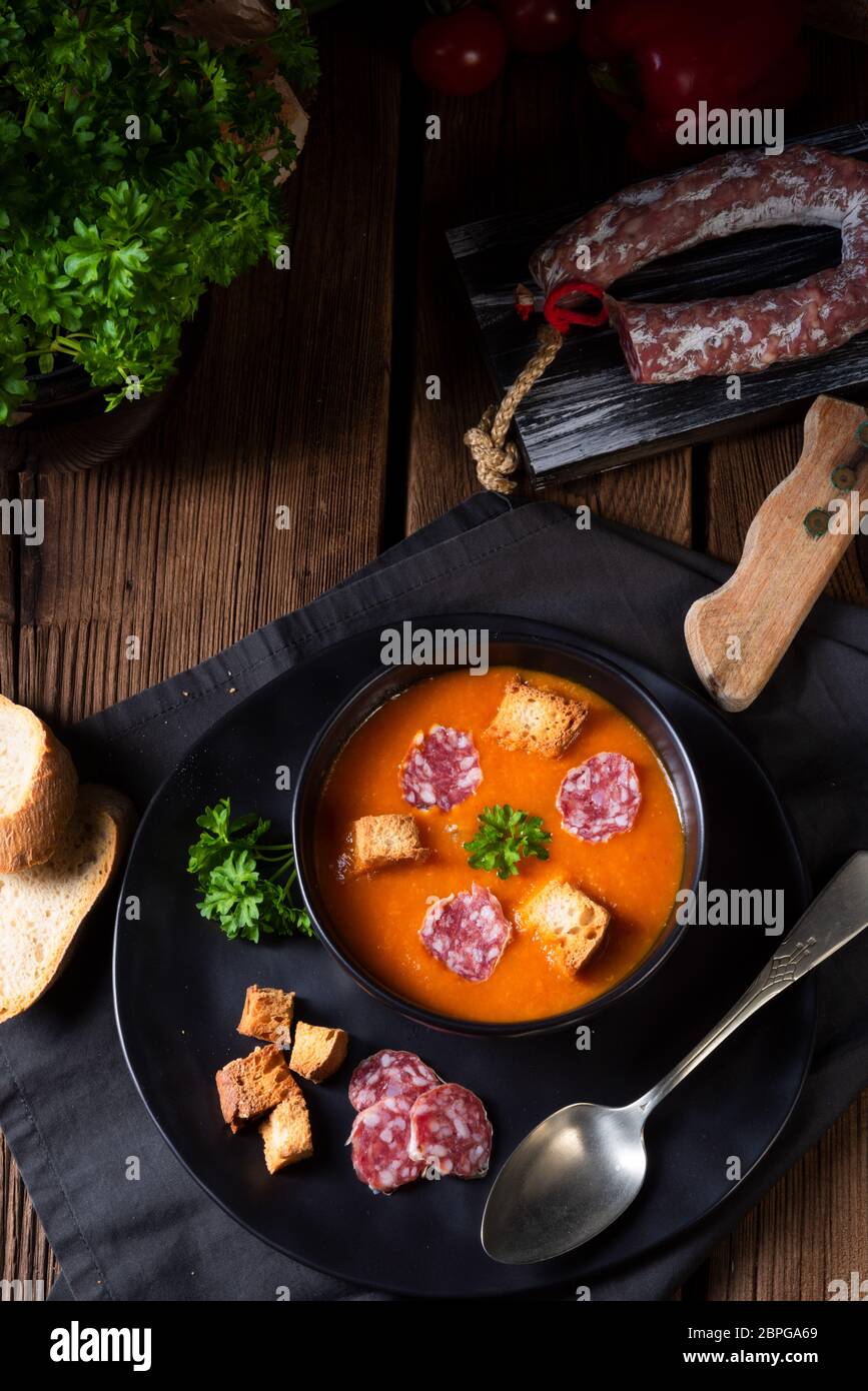 Hungarian paprika cream soup with spicy sausage Stock Photo