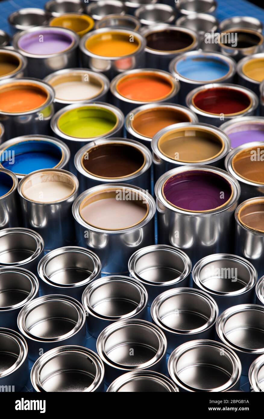 Concept group of tin metal cans with color paint Stock Photo - Alamy