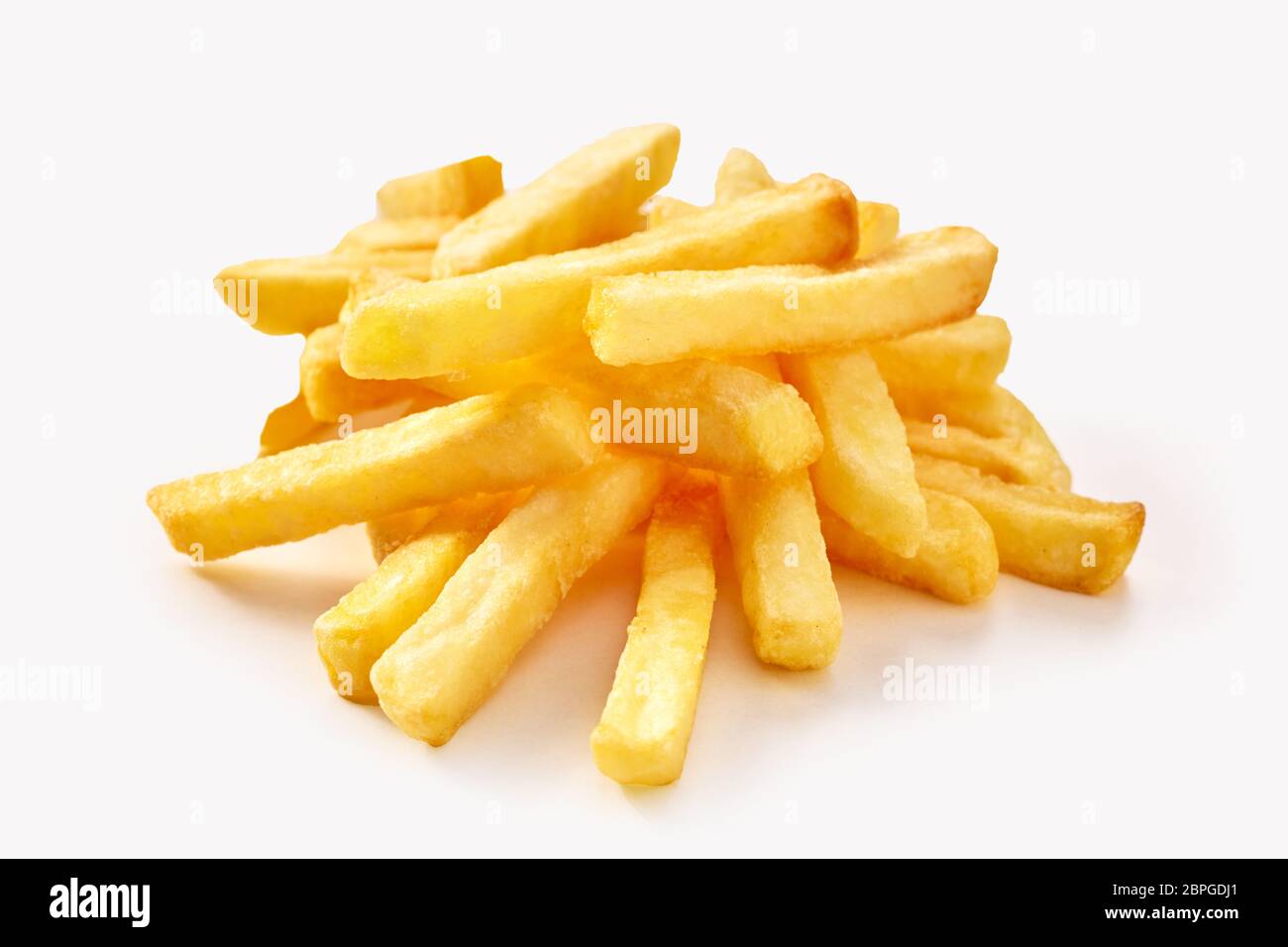 Small pile of french fries in close-up isolated on white background ...