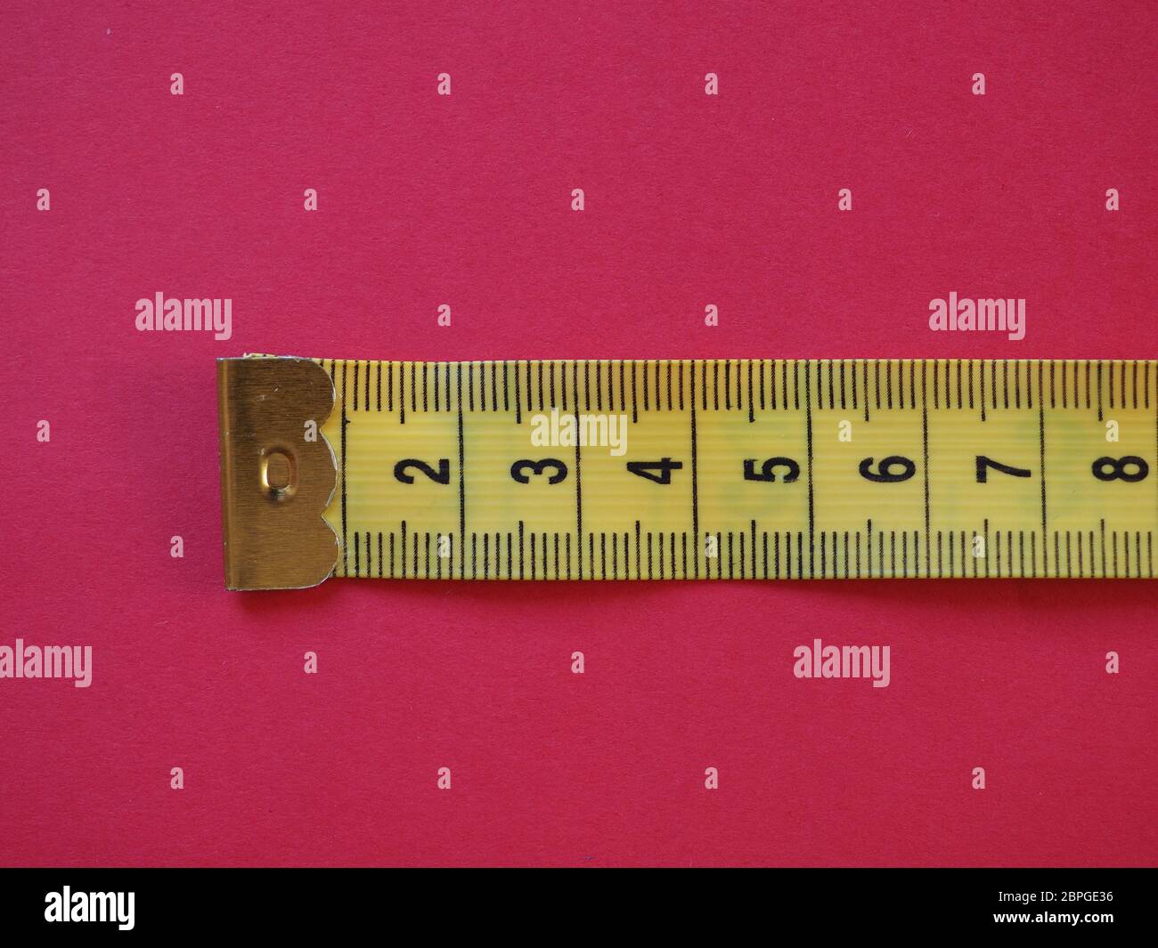 a ruler with metric units, over red background Stock Photo Alamy