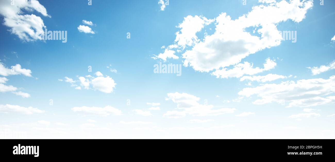 Clear blue sky and white clouds summer background Stock Photo - Alamy