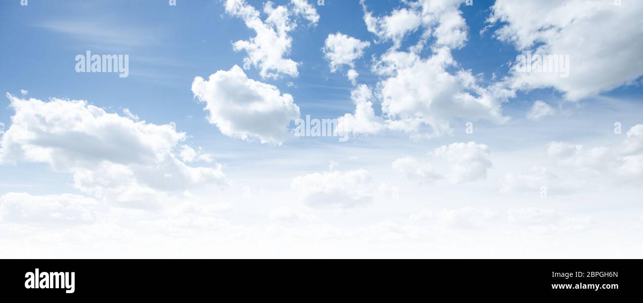 Clear blue sky and white clouds summer background Stock Photo - Alamy