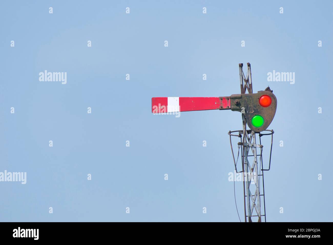 A railway signal is a visual display device that conveys instructions or provides advance warning of instructions regarding the driver’s authority to Stock Photo