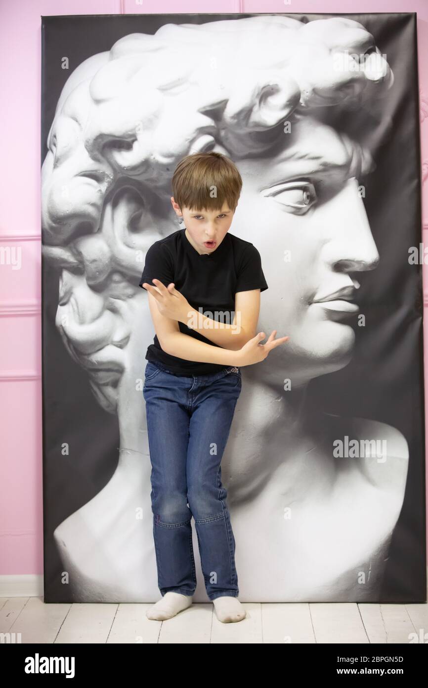 Belraus, the city of Gomil, March 29, 2020. Photo Studio. Child with a portrait of the Greek god Apalon. Stock Photo