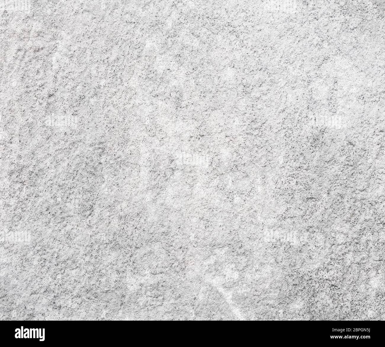 Background with white plaster wall with uneven surface Stock Photo