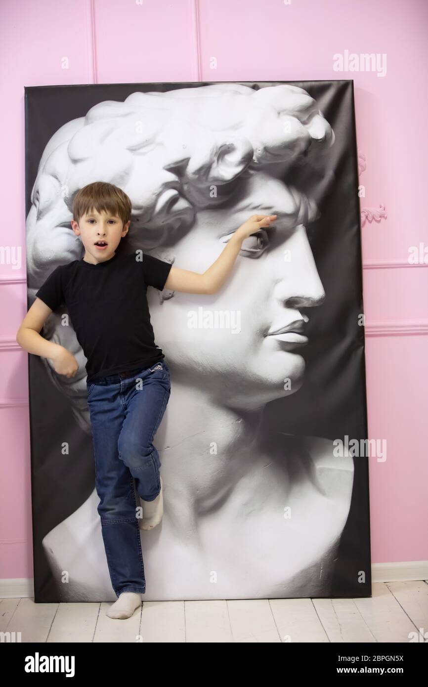 Belraus, the city of Gomil, March 29, 2020. Photo Studio. Child with a portrait of the Greek god Apalon. Stock Photo