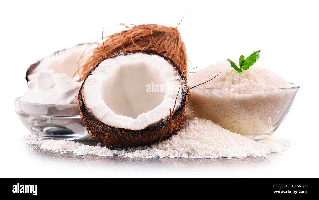 Composition with shredded coconut and shells isolated on white background Stock Photo