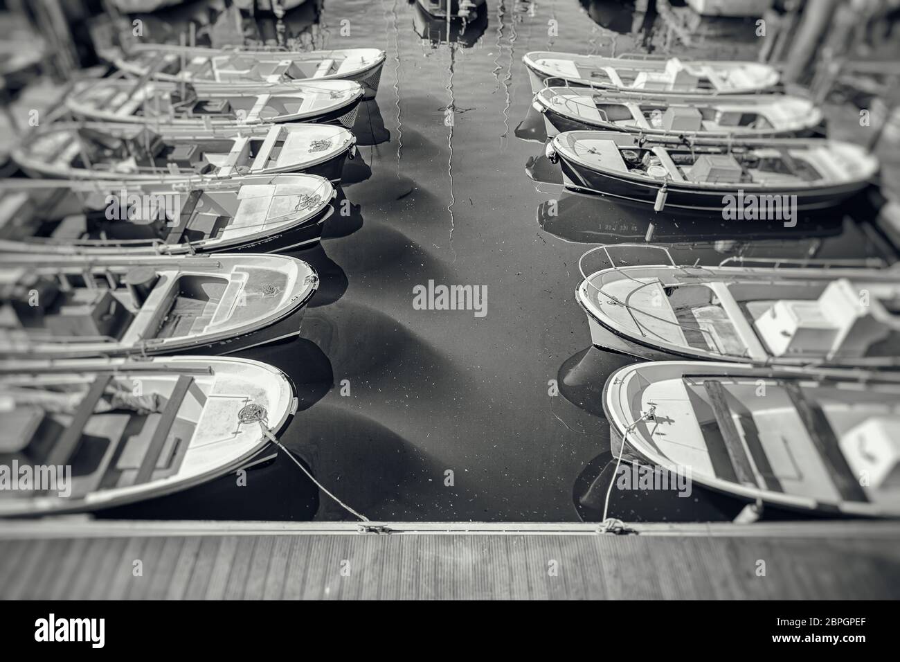 Boats moored at a marine dock, detail of recreational boats on a dock ...