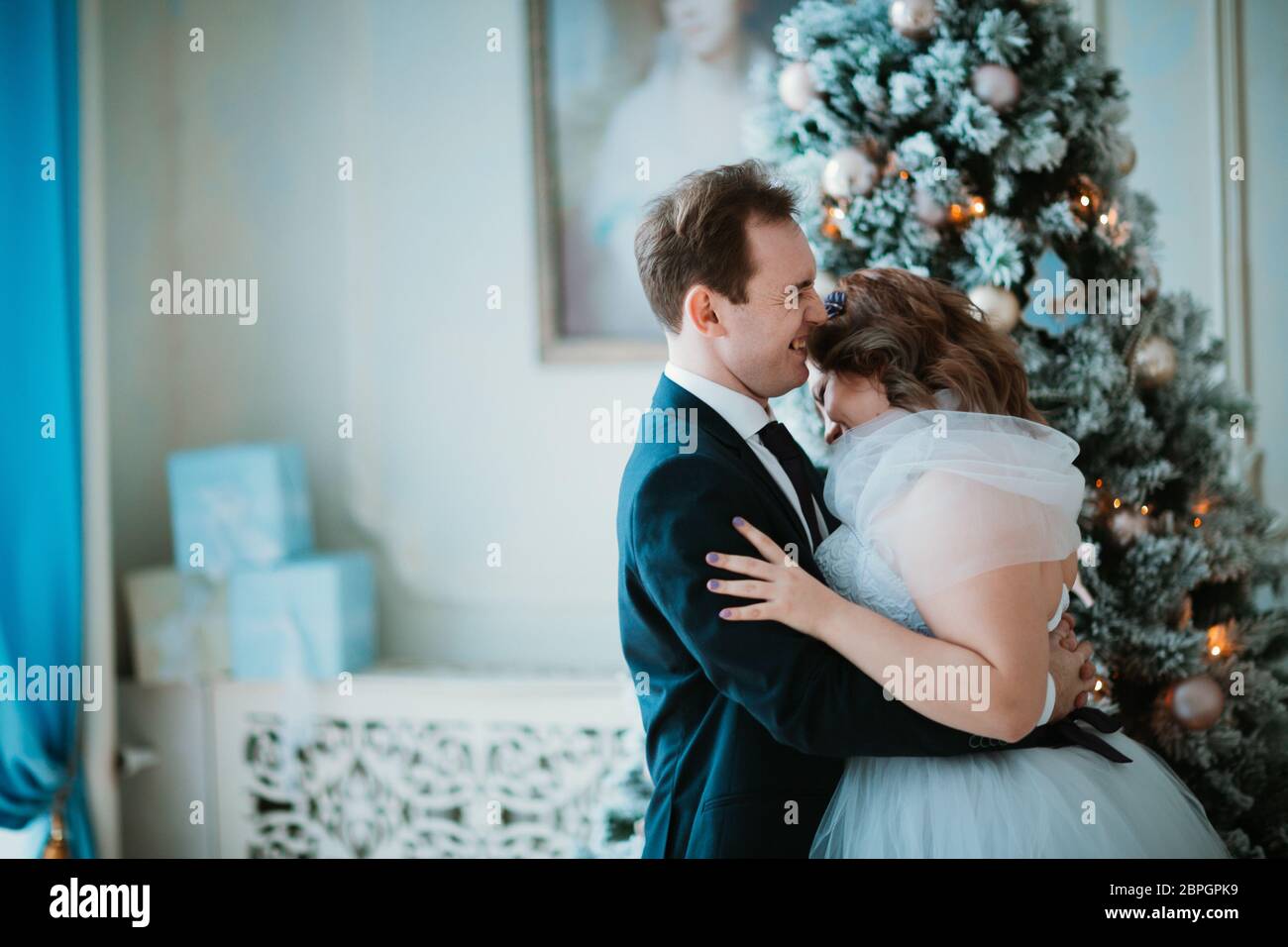 young bride and groom couple in a bright studio photo Stock Photo - Alamy